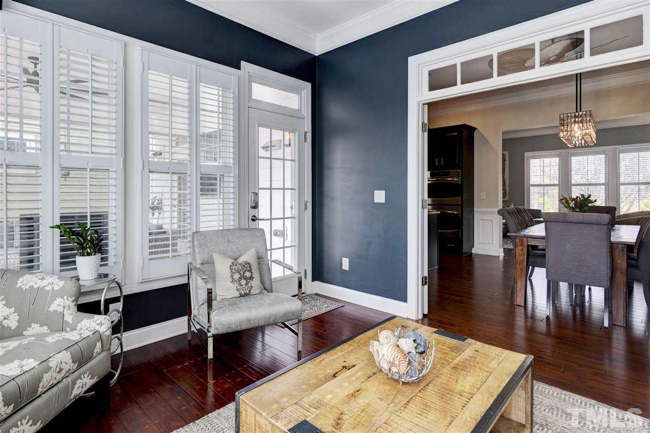 1585 Fullerton Place Raleigh, NC 27607 - Photo 16 of 30 a living room with furniture and wooden floor