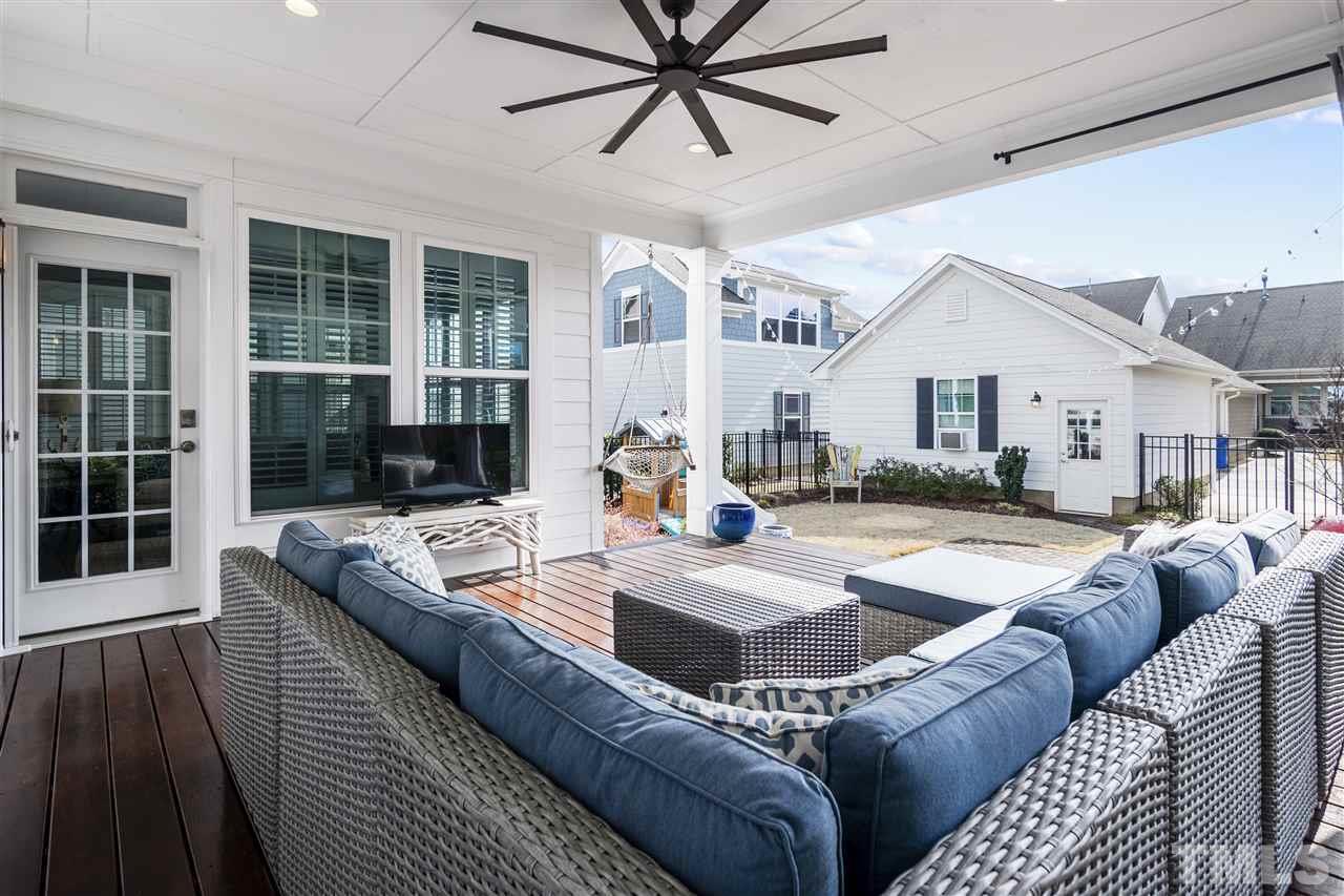 1585 Fullerton Place Raleigh, NC 27607 - Photo 25 of 30 a living room with furniture and a large window