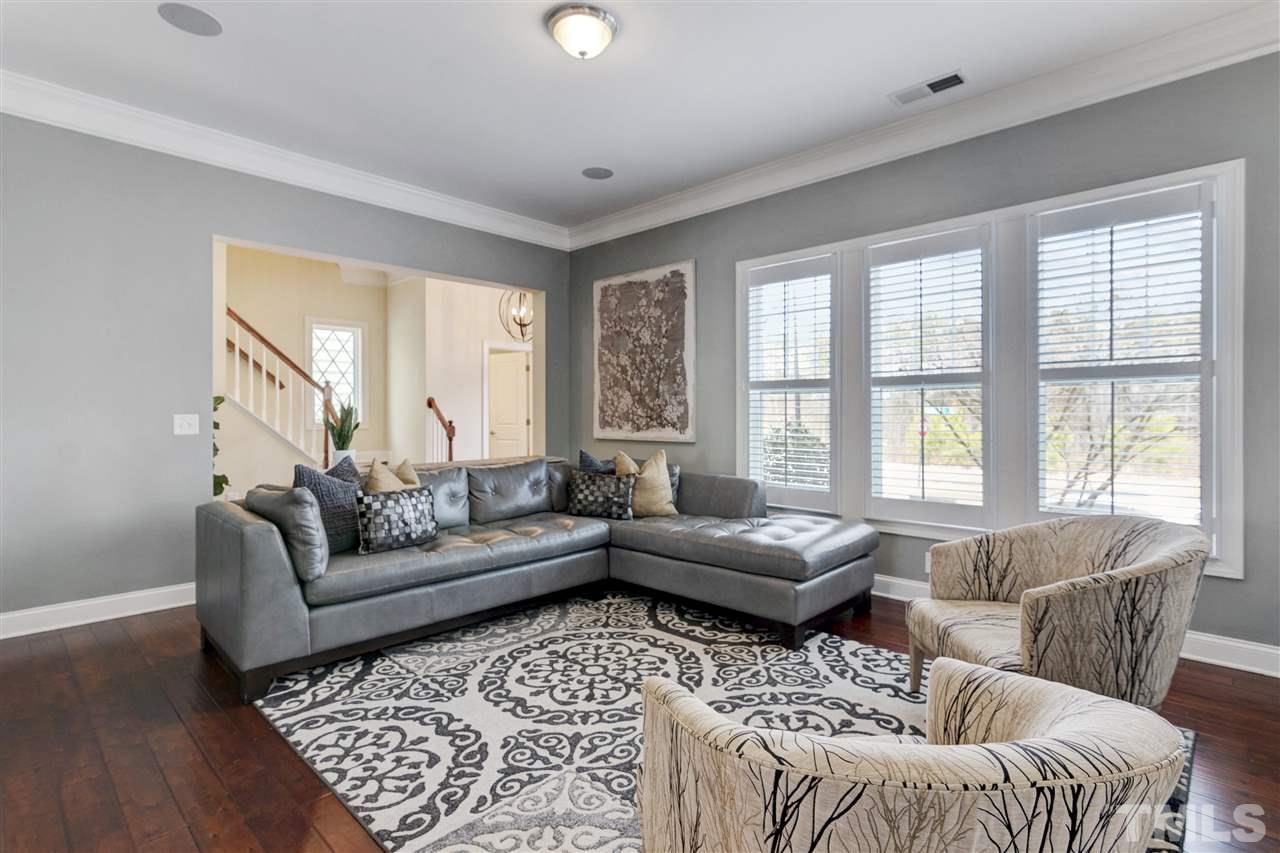 1585 Fullerton Place Raleigh, NC 27607 - Photo 6 of 30 a living room with furniture and a large window