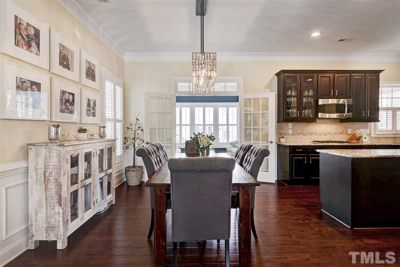 1585 Fullerton Place Raleigh, NC 27607 - Photo 7 of 30 a view of a dining room with furniture window and wooden floor