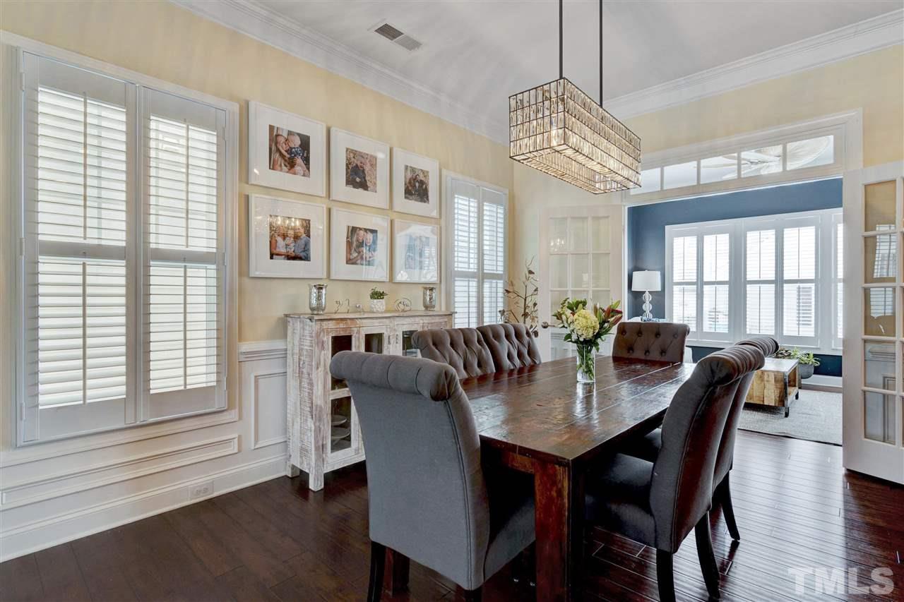 1585 Fullerton Place Raleigh, NC 27607 - Photo 8 of 30 a view of a a dining room with furniture window and wooden floor
