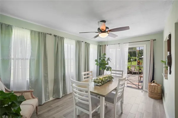 a view of a livingroom with furniture and a potted plant