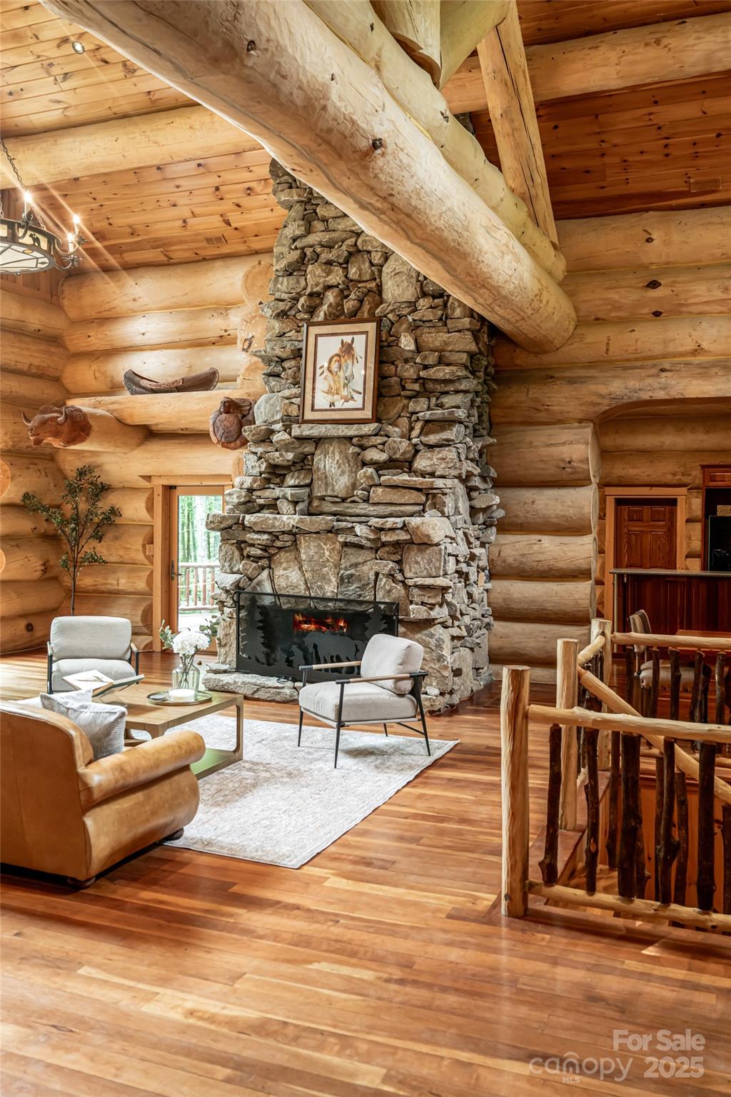 303 Flying Hawk Road Waynesville, NC 28786 - Photo 11 of 48 a living room with furniture and a fireplace