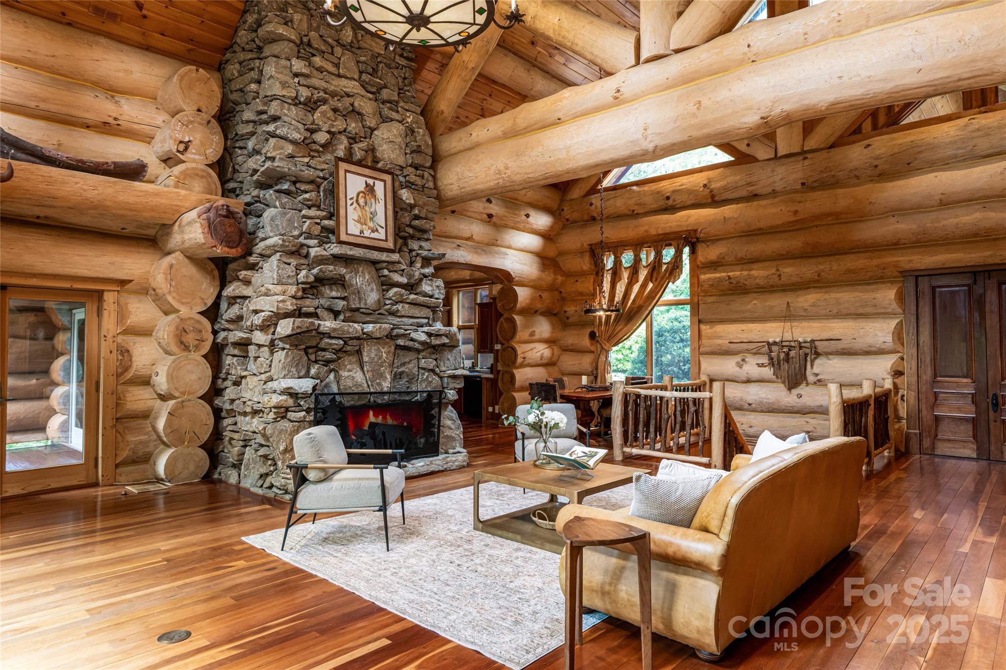 303 Flying Hawk Road Waynesville, NC 28786 - Photo 14 of 48 a living room with furniture and a fireplace