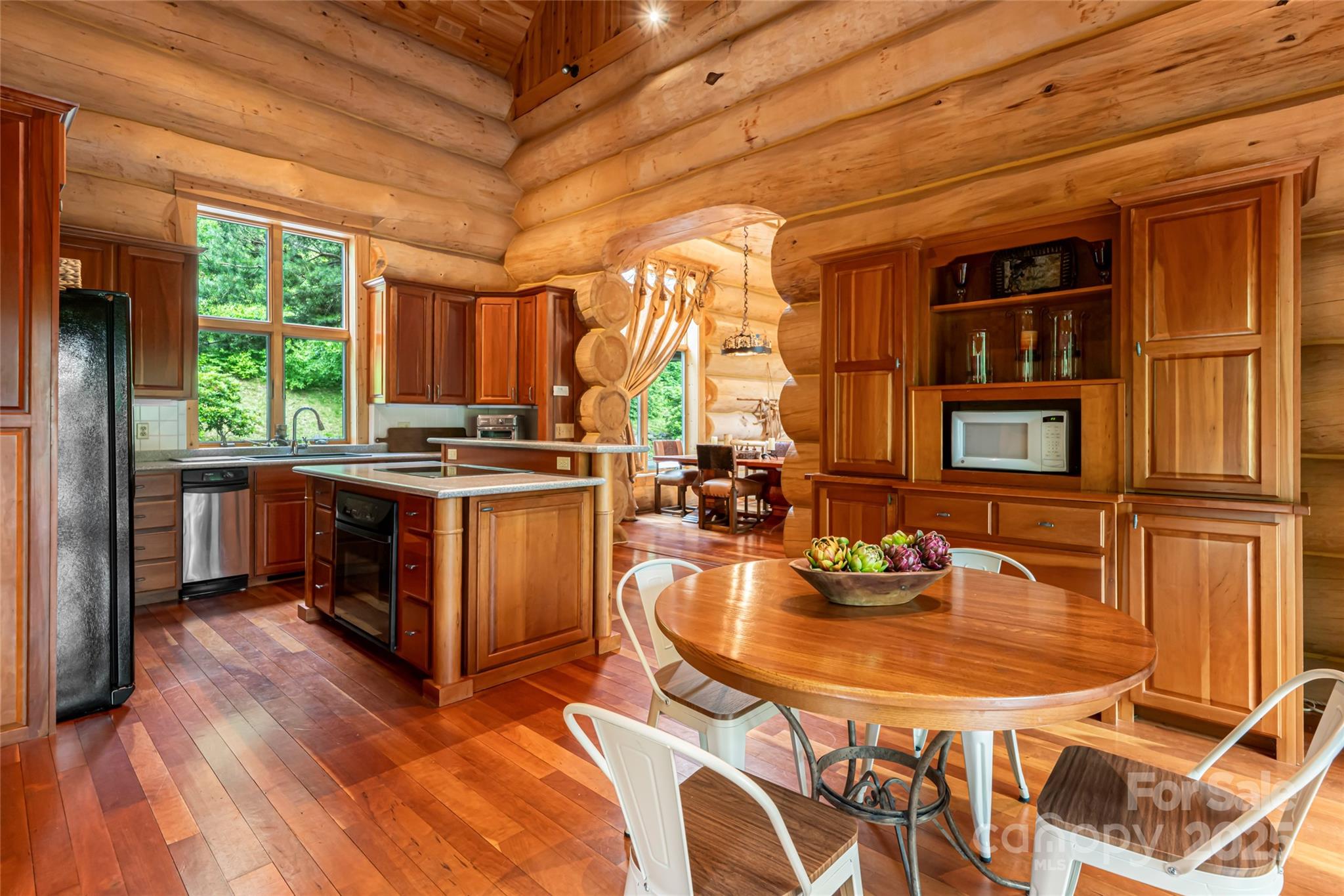 303 Flying Hawk Road Waynesville, NC 28786 - Photo 17 of 48 a table and chairs in a room