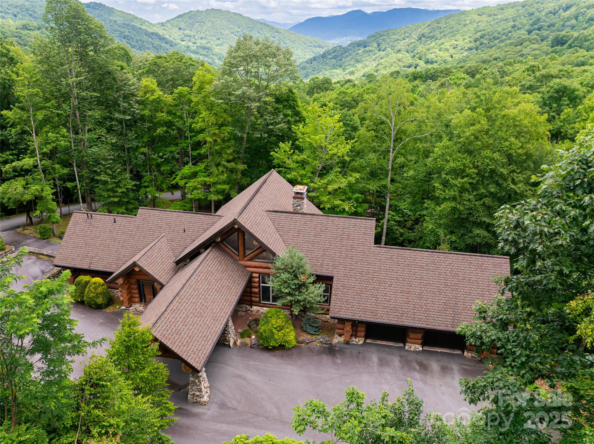 303 Flying Hawk Road Waynesville, NC 28786 - Photo 2 of 48 an aerial view of a house with yard and outdoor seating