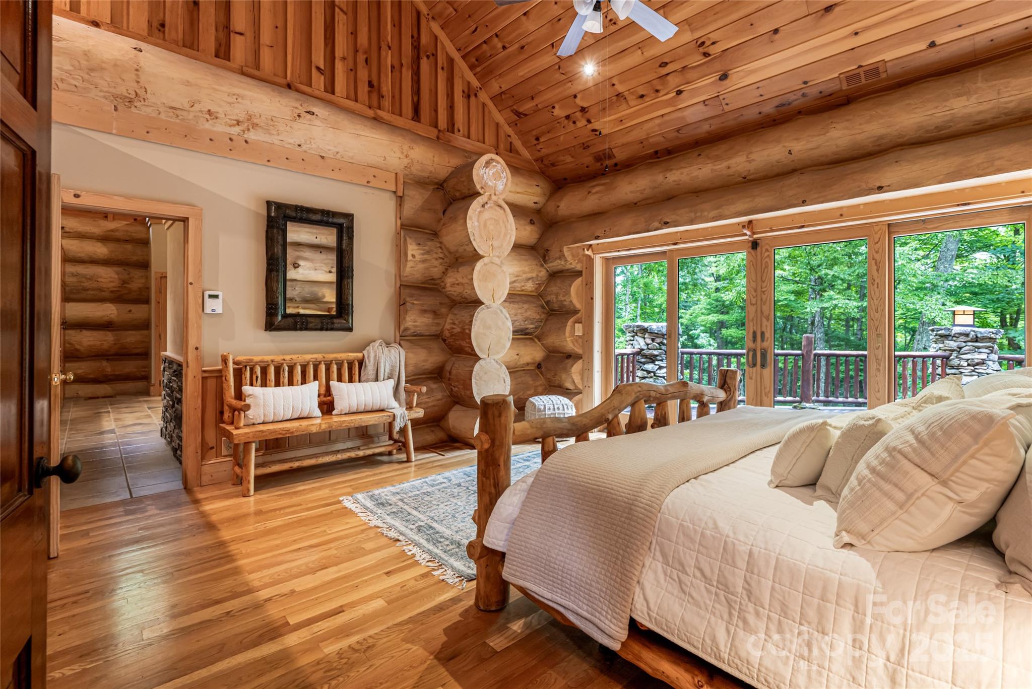 303 Flying Hawk Road Waynesville, NC 28786 - Photo 22 of 48 a bedroom with furniture and a large window