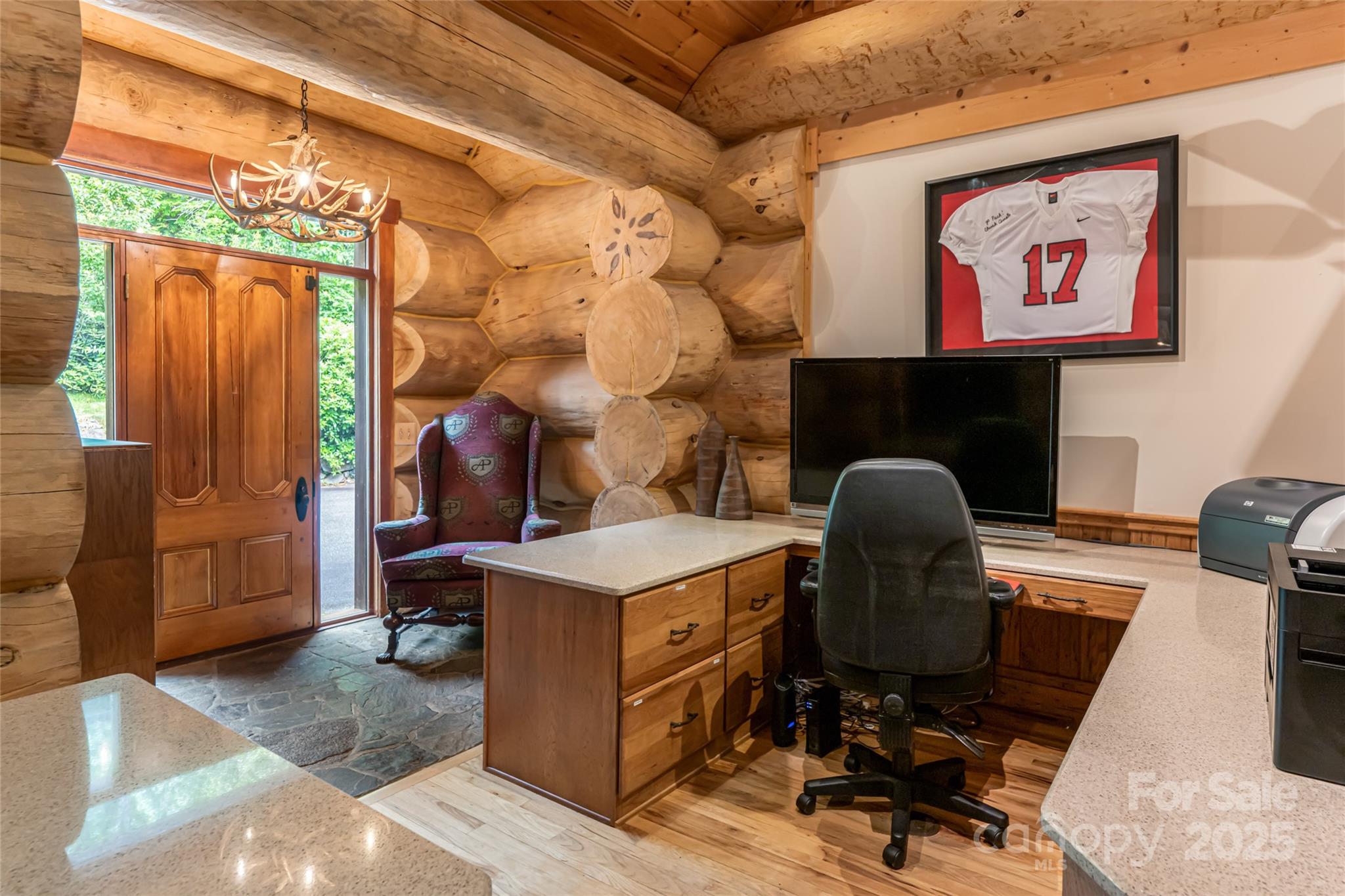 303 Flying Hawk Road Waynesville, NC 28786 - Photo 27 of 48 a workspace with furniture and a fireplace