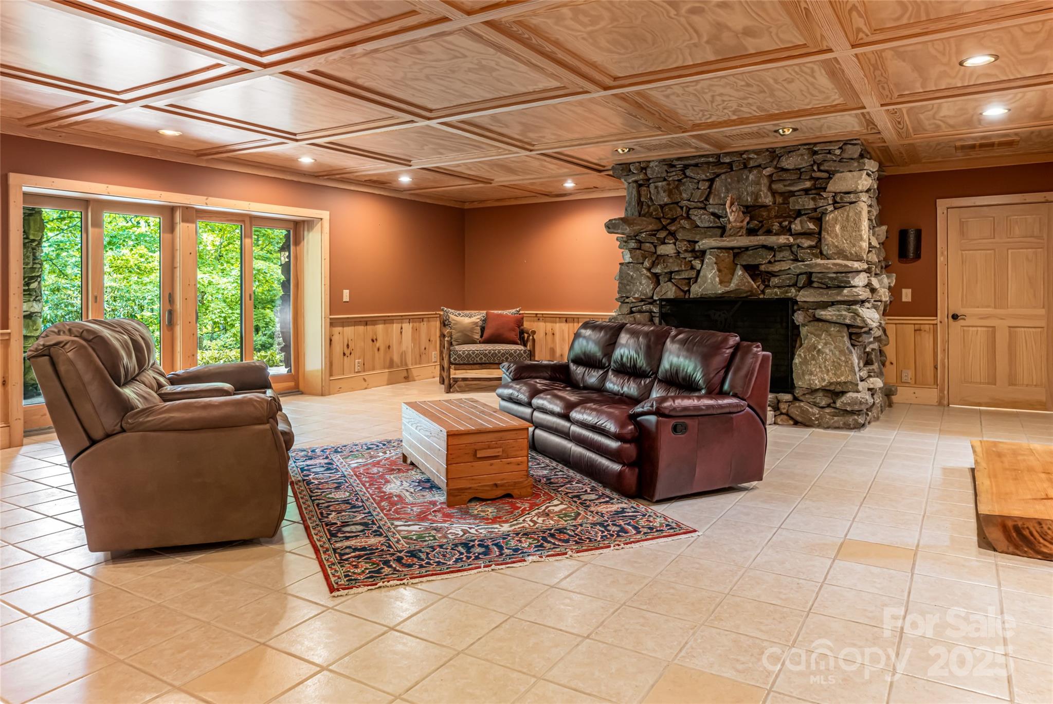 303 Flying Hawk Road Waynesville, NC 28786 - Photo 30 of 48 a living room with furniture and a fireplace