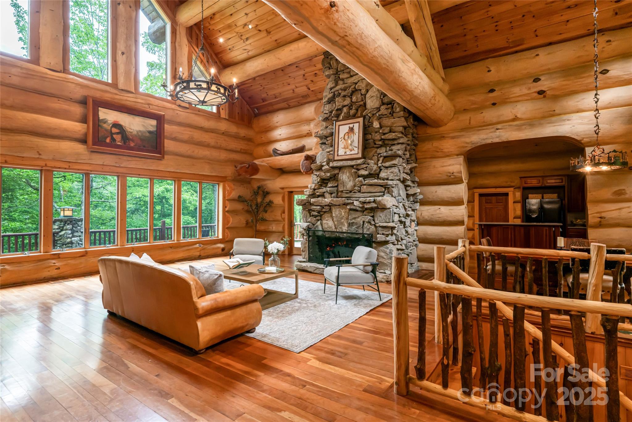 303 Flying Hawk Road Waynesville, NC 28786 - Photo 3 of 48 a building outdoor space with patio furniture and wooden floor