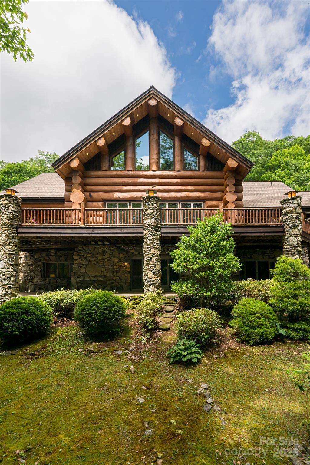 303 Flying Hawk Road Waynesville, NC 28786 - Photo 39 of 48 a front view of a house with garden
