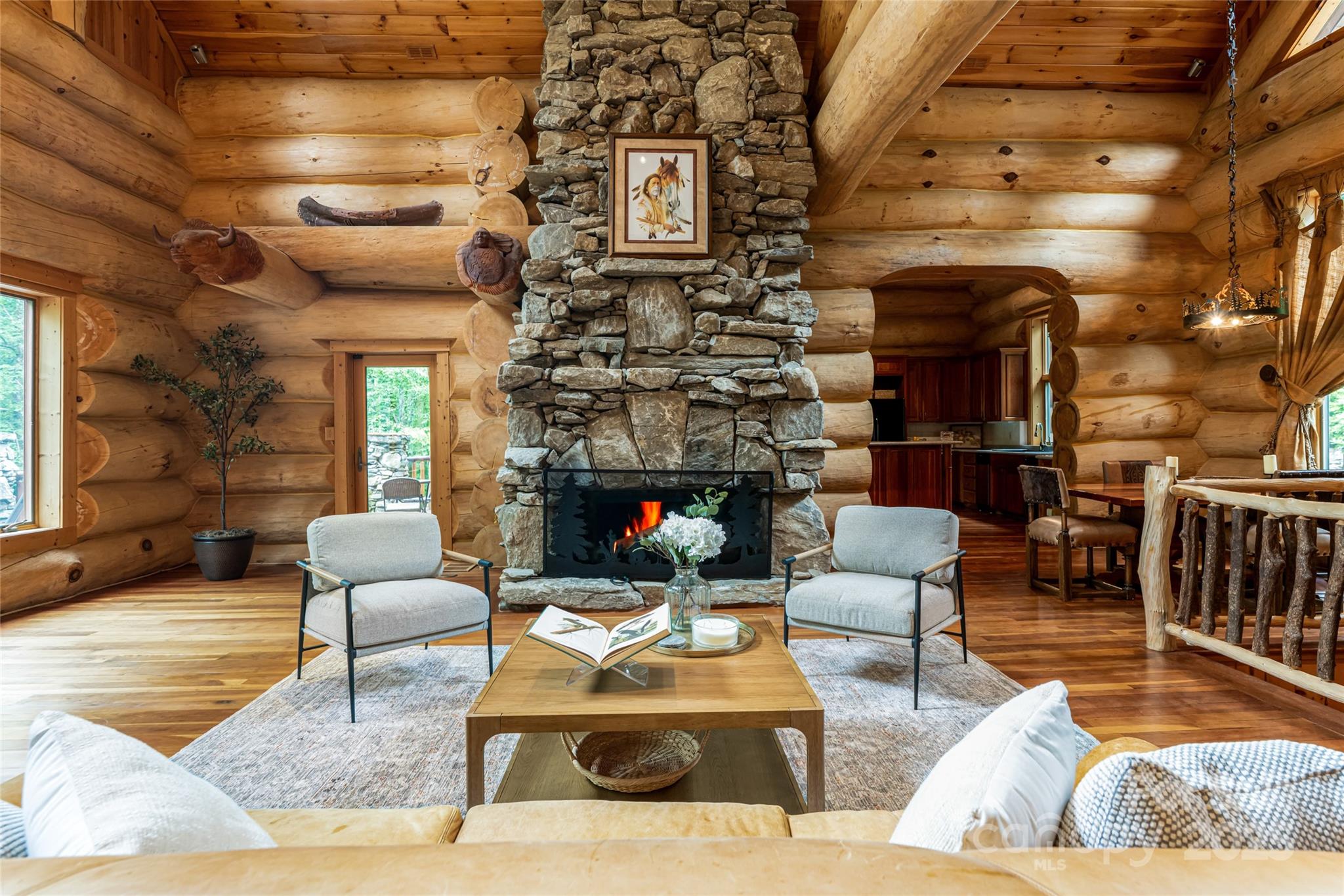 303 Flying Hawk Road Waynesville, NC 28786 - Photo 4 of 48 a living room with furniture and a fireplace