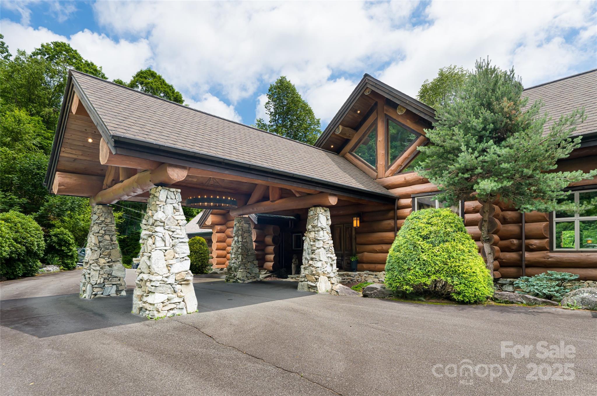303 Flying Hawk Road Waynesville, NC 28786 - Photo 41 of 48 front view of a house with a garage