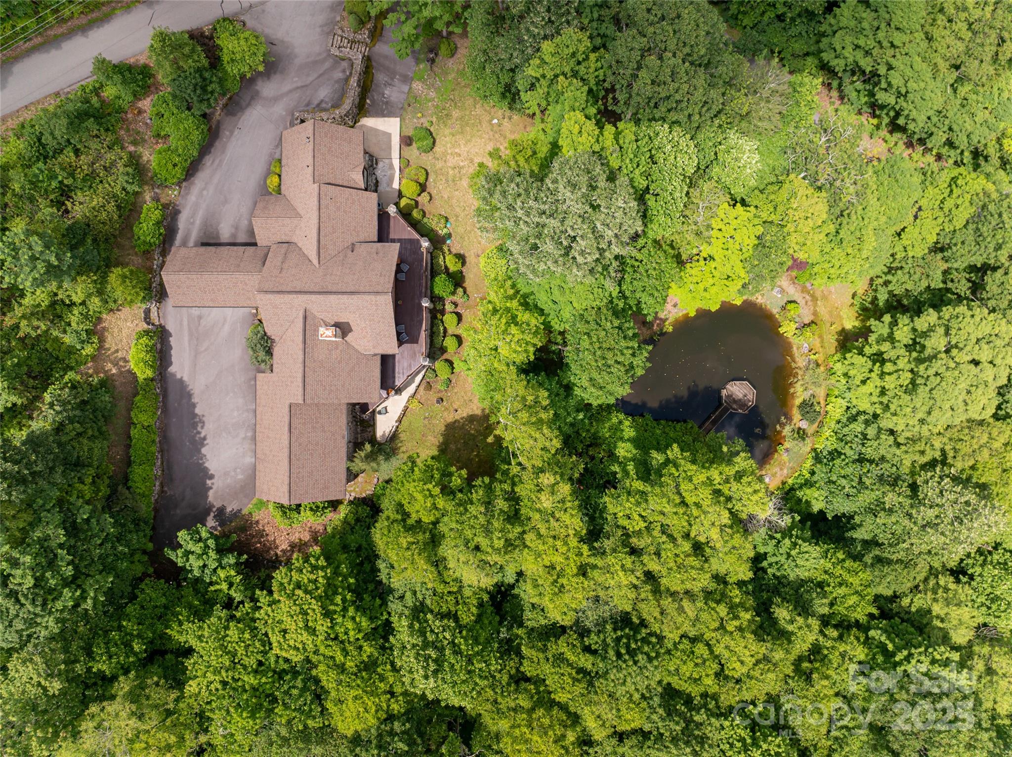 303 Flying Hawk Road Waynesville, NC 28786 - Photo 47 of 48 an aerial view of a house with a yard
