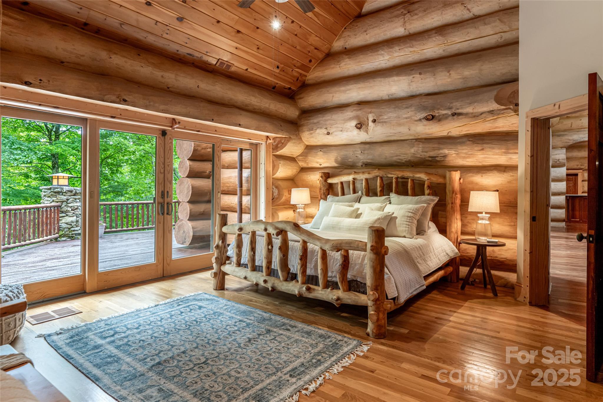 303 Flying Hawk Road Waynesville, NC 28786 - Photo 5 of 48 a bed sitting in a spacious bedroom next to a window