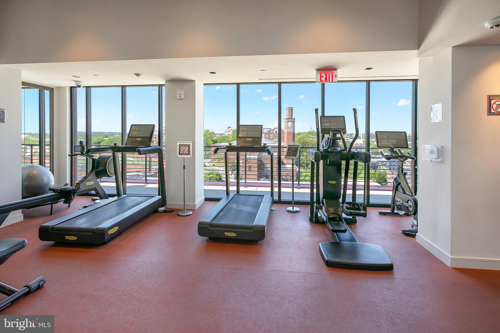 1625 Eckington Place Northeast, Unit 421 Washington, DC 20002 - Photo 27 of 40 a room with gym equipment and a large window