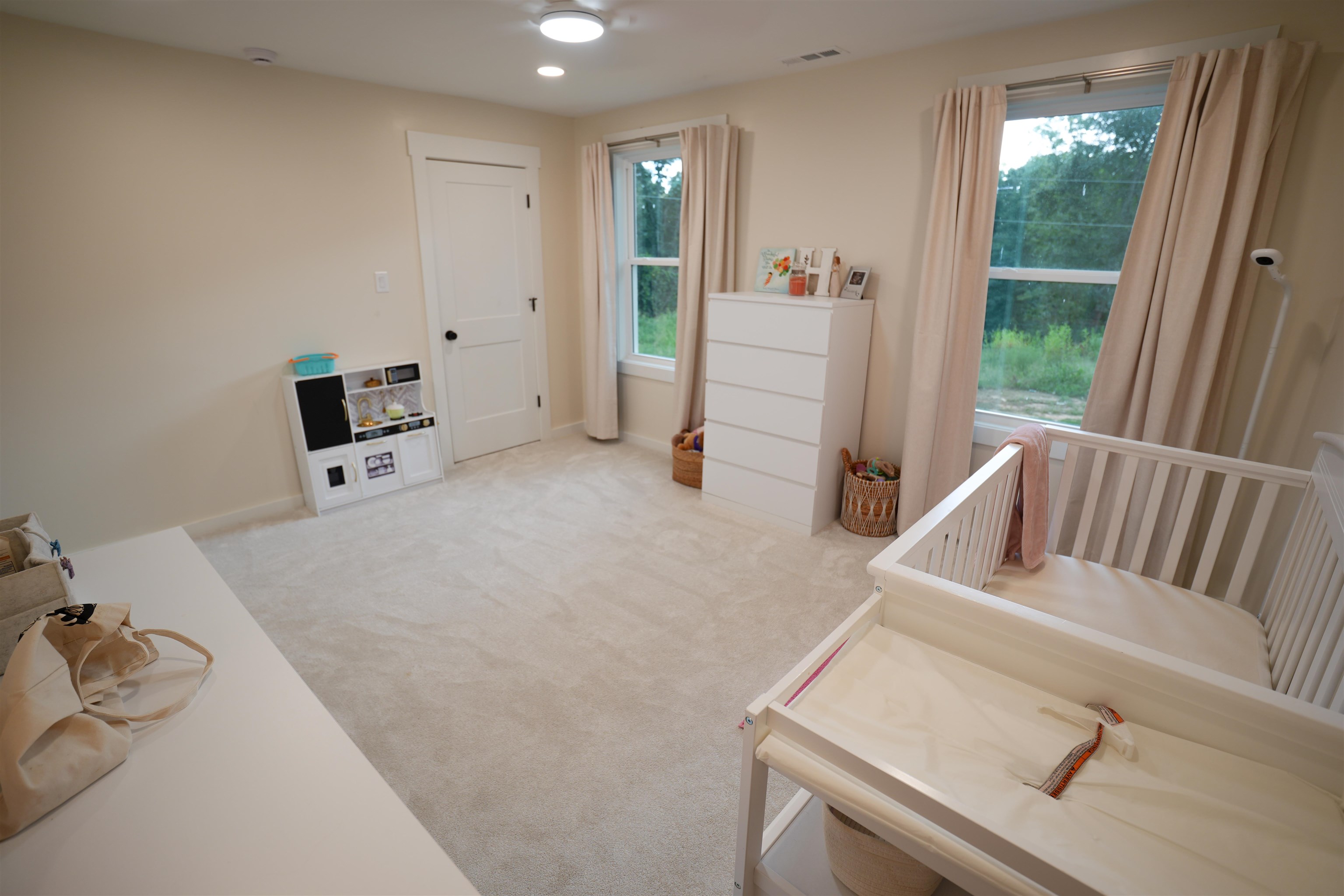 2525 Pittman Road Somerville, TN 38068 - Photo 13 of 38 Plush carpet flooring, recessed lighting, and dual windows with natural light
