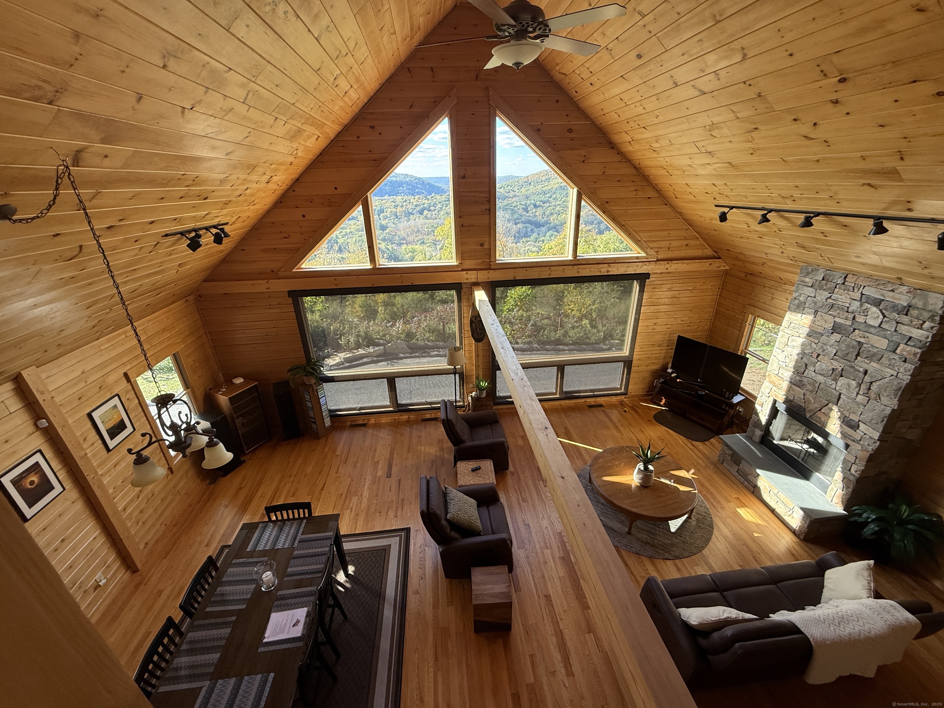 570 Long Mountain Road New Milford, CT 06776 - Photo 12 of 30 a view of a living room with furniture and a floor to ceiling window