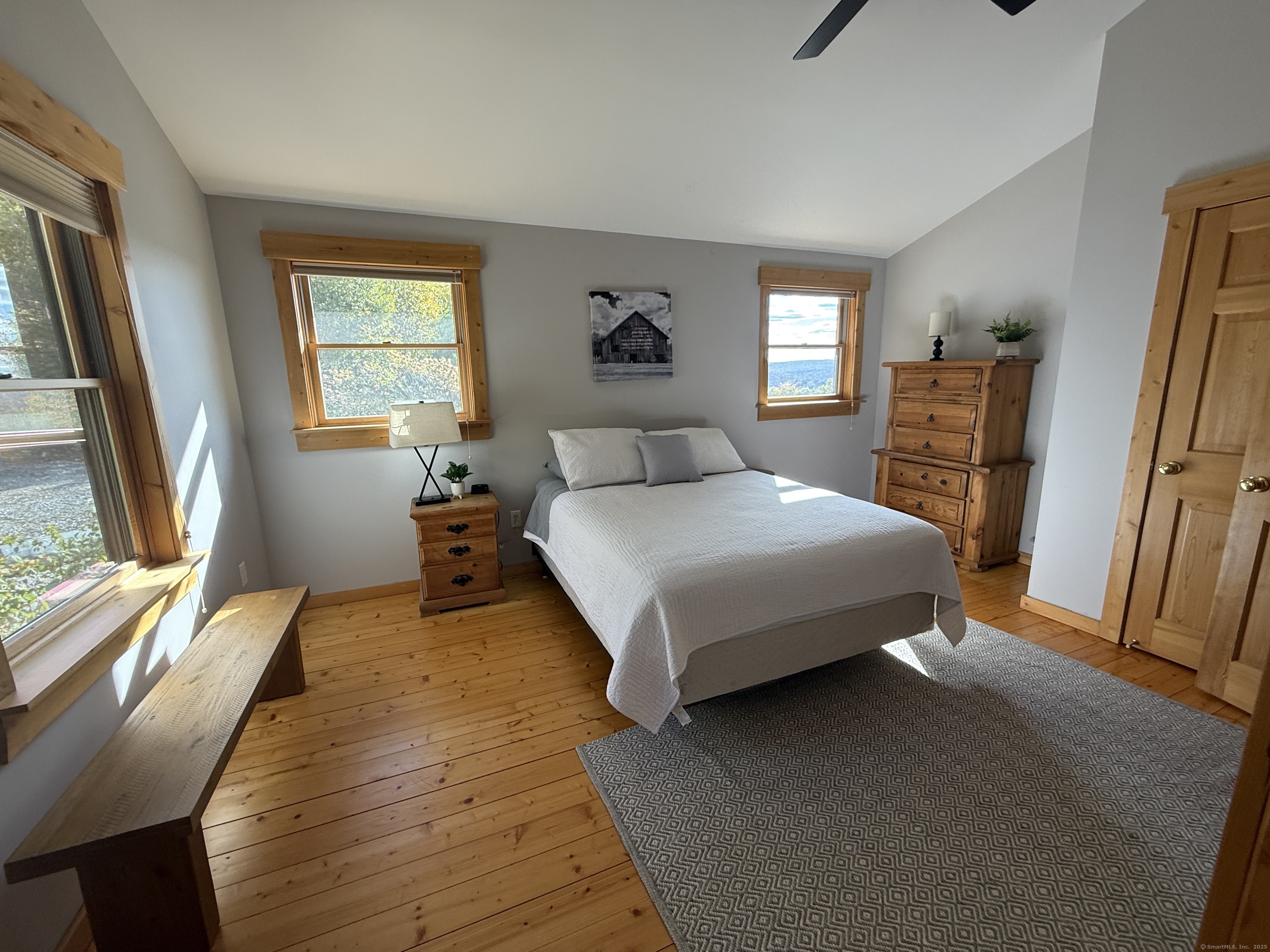 570 Long Mountain Road New Milford, CT 06776 - Photo 15 of 30 a bedroom with a bed a dresser next to a window