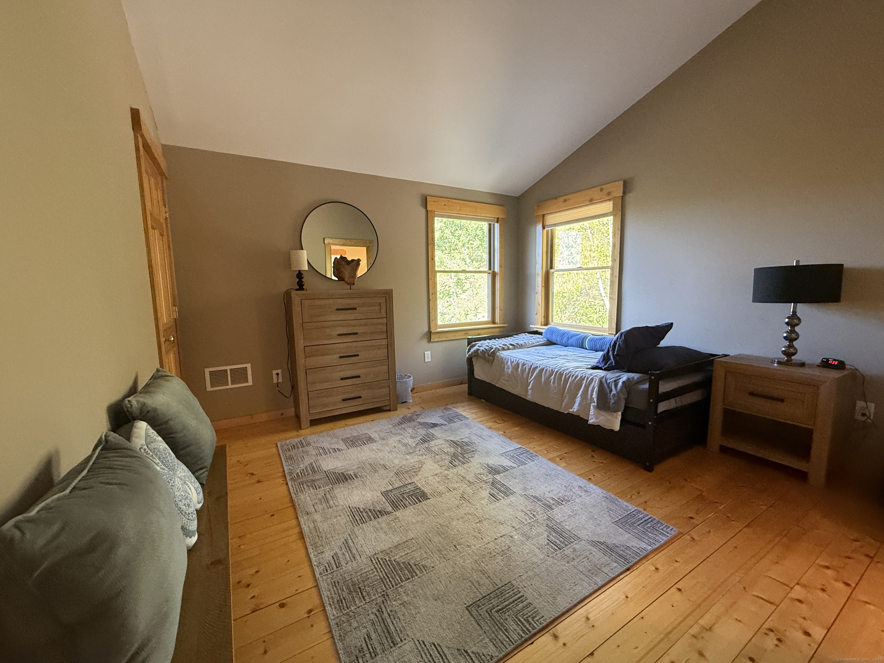 570 Long Mountain Road New Milford, CT 06776 - Photo 16 of 30 a bedroom with a bed and a tv