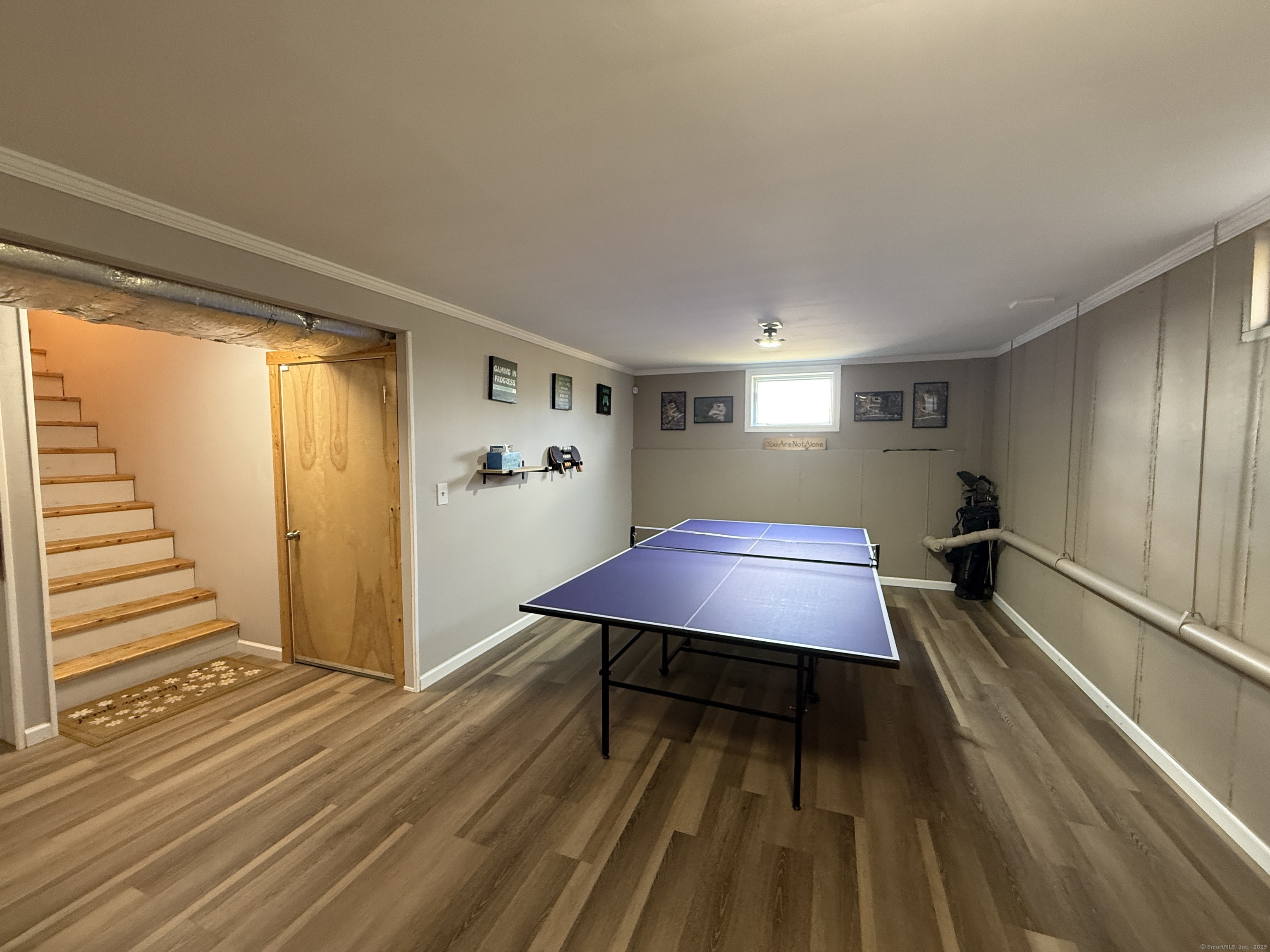 570 Long Mountain Road New Milford, CT 06776 - Photo 19 of 30 a room with wooden floor pool table and windows