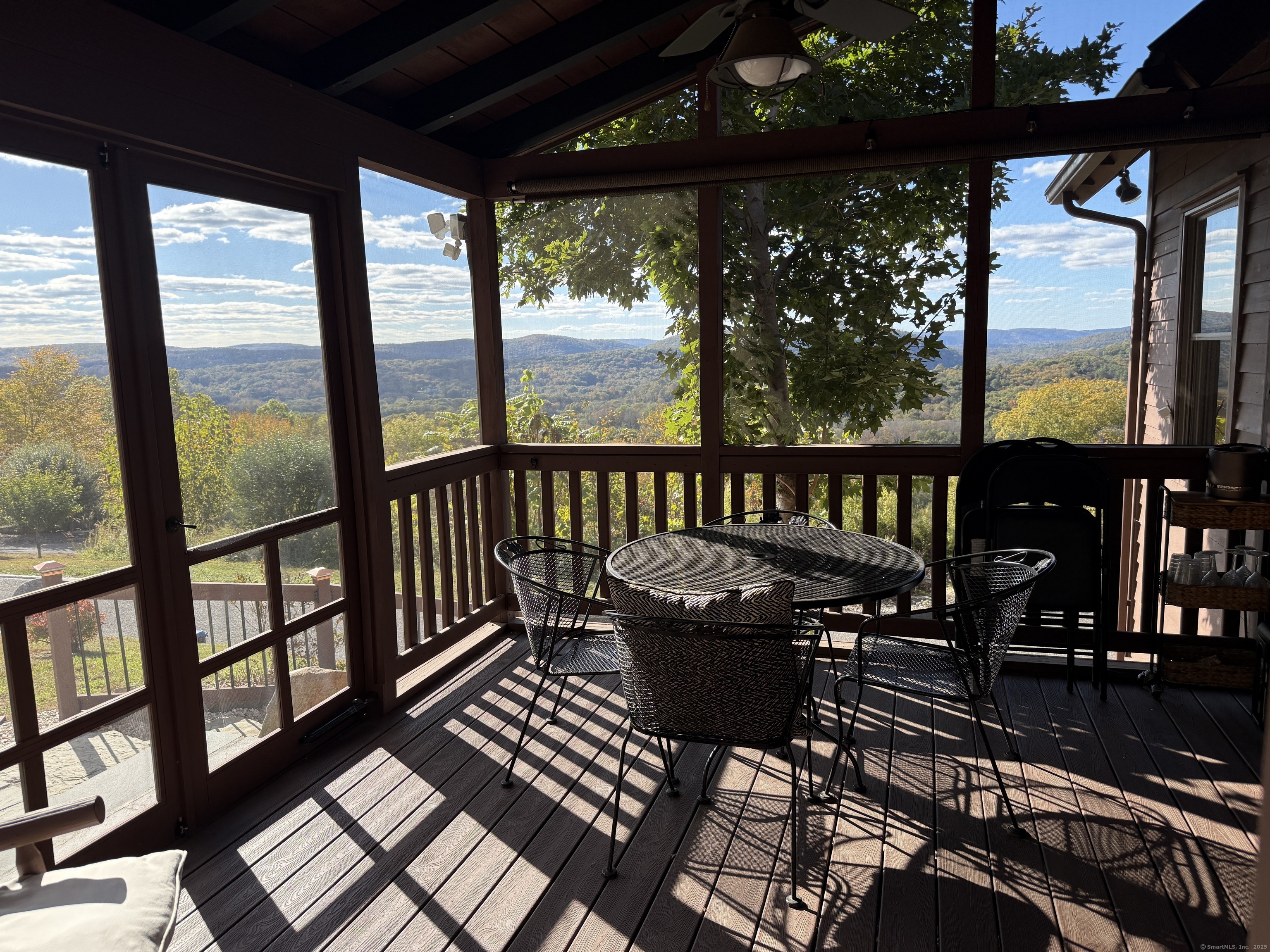 570 Long Mountain Road New Milford, CT 06776 - Photo 20 of 30 a view of a chairs and table in the balcony