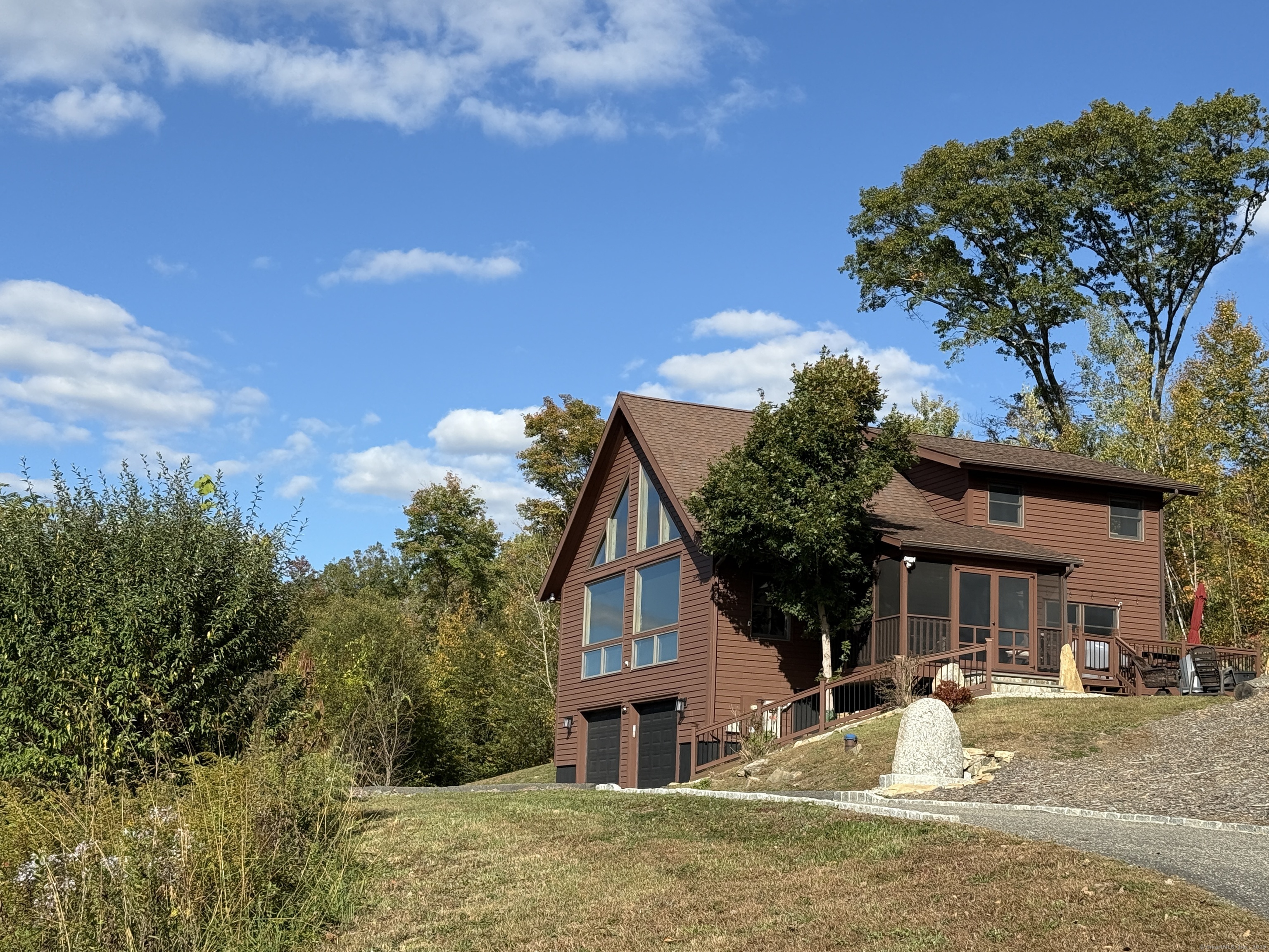 570 Long Mountain Road New Milford, CT 06776 - Photo 21 of 30 a front view of a house with a yard