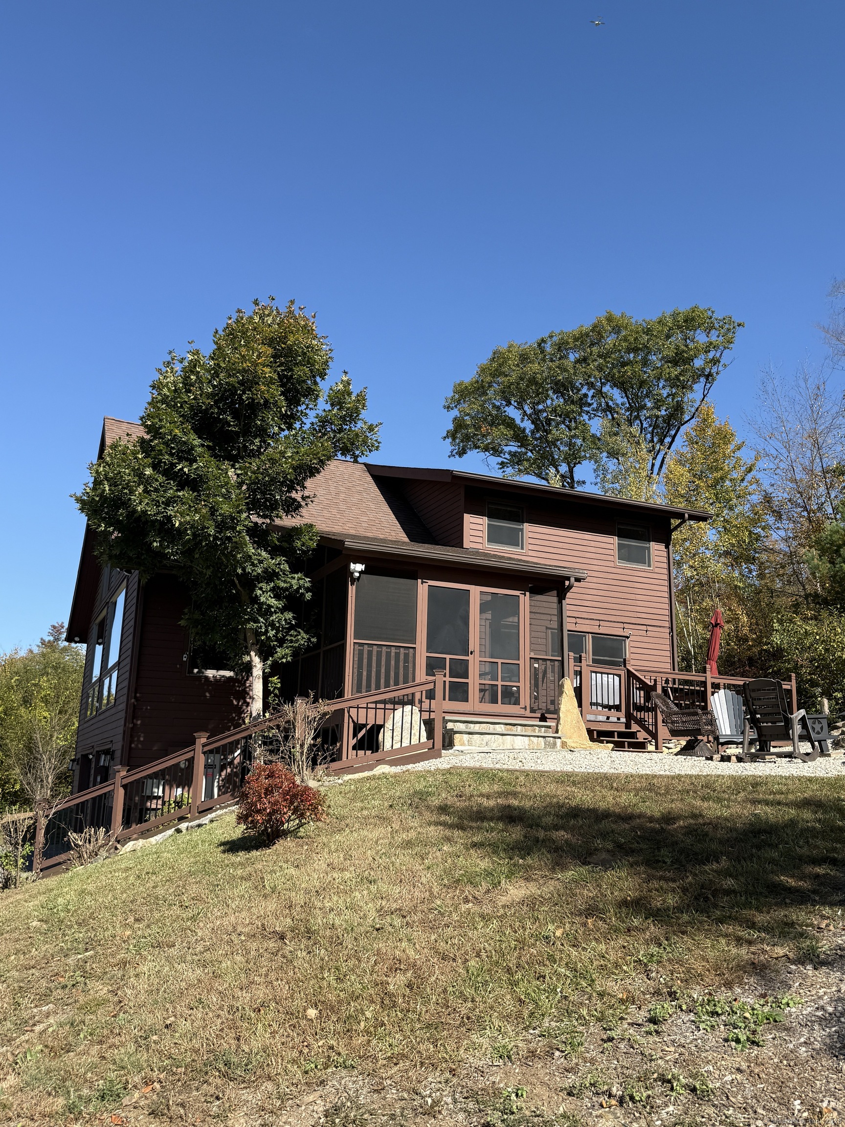 570 Long Mountain Road New Milford, CT 06776 - Photo 25 of 30 a backyard of a house with table and chairs with plants