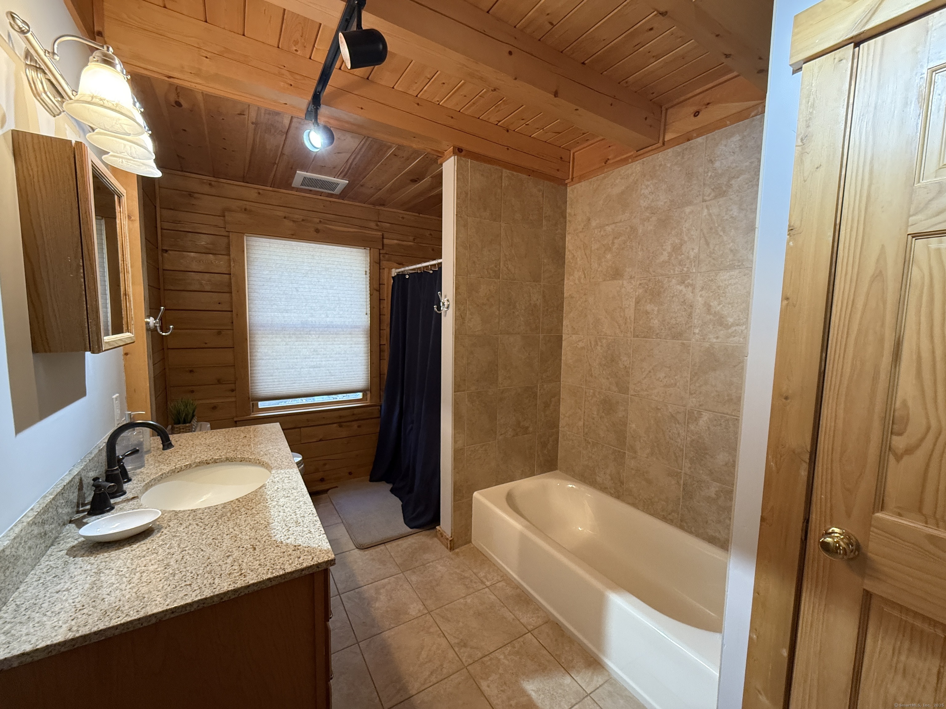 570 Long Mountain Road New Milford, CT 06776 - Photo 27 of 30 a bathroom with a granite countertop sink and a mirror