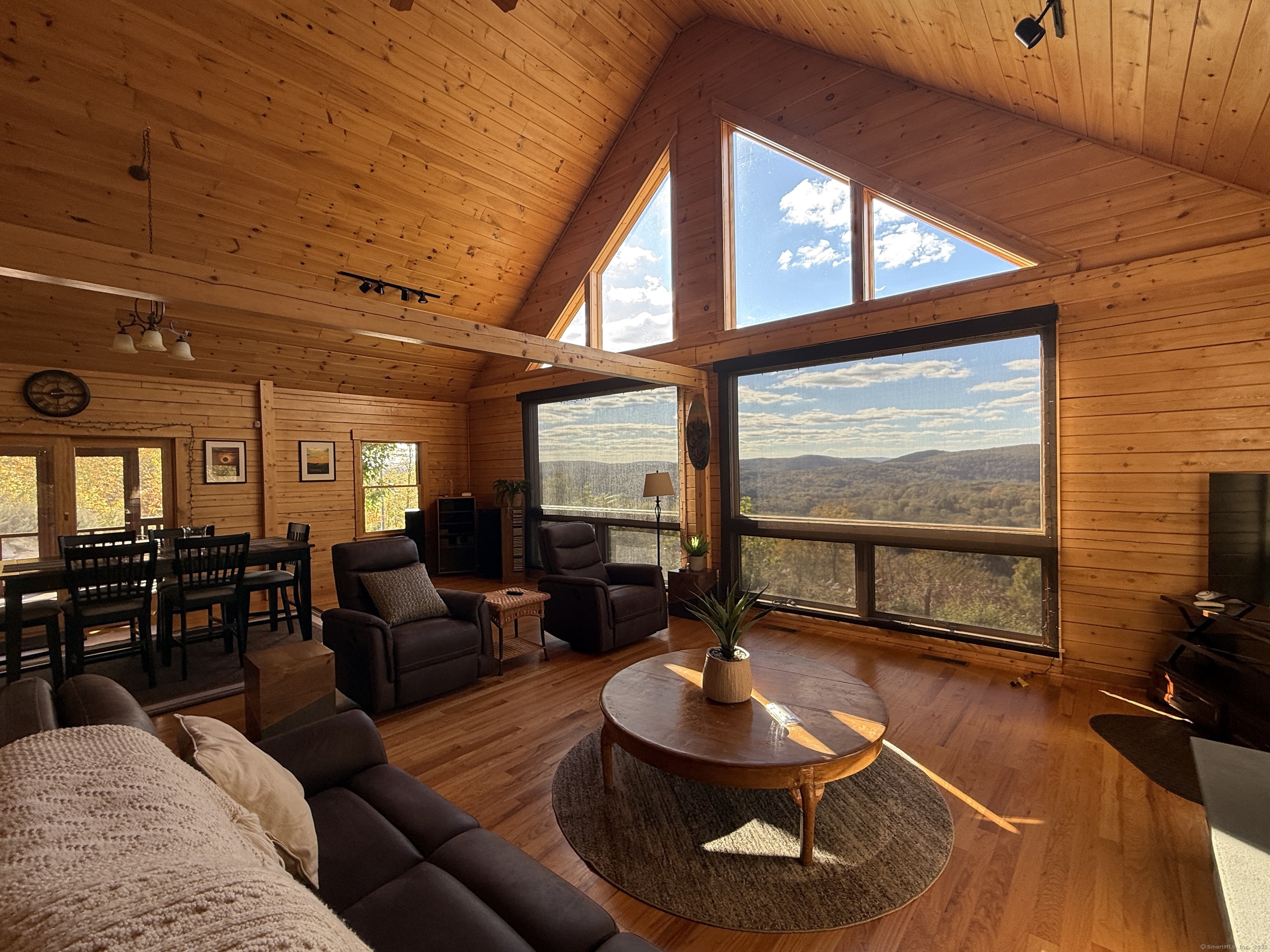 570 Long Mountain Road New Milford, CT 06776 - Photo 7 of 30 a living room with furniture and a floor to ceiling window
