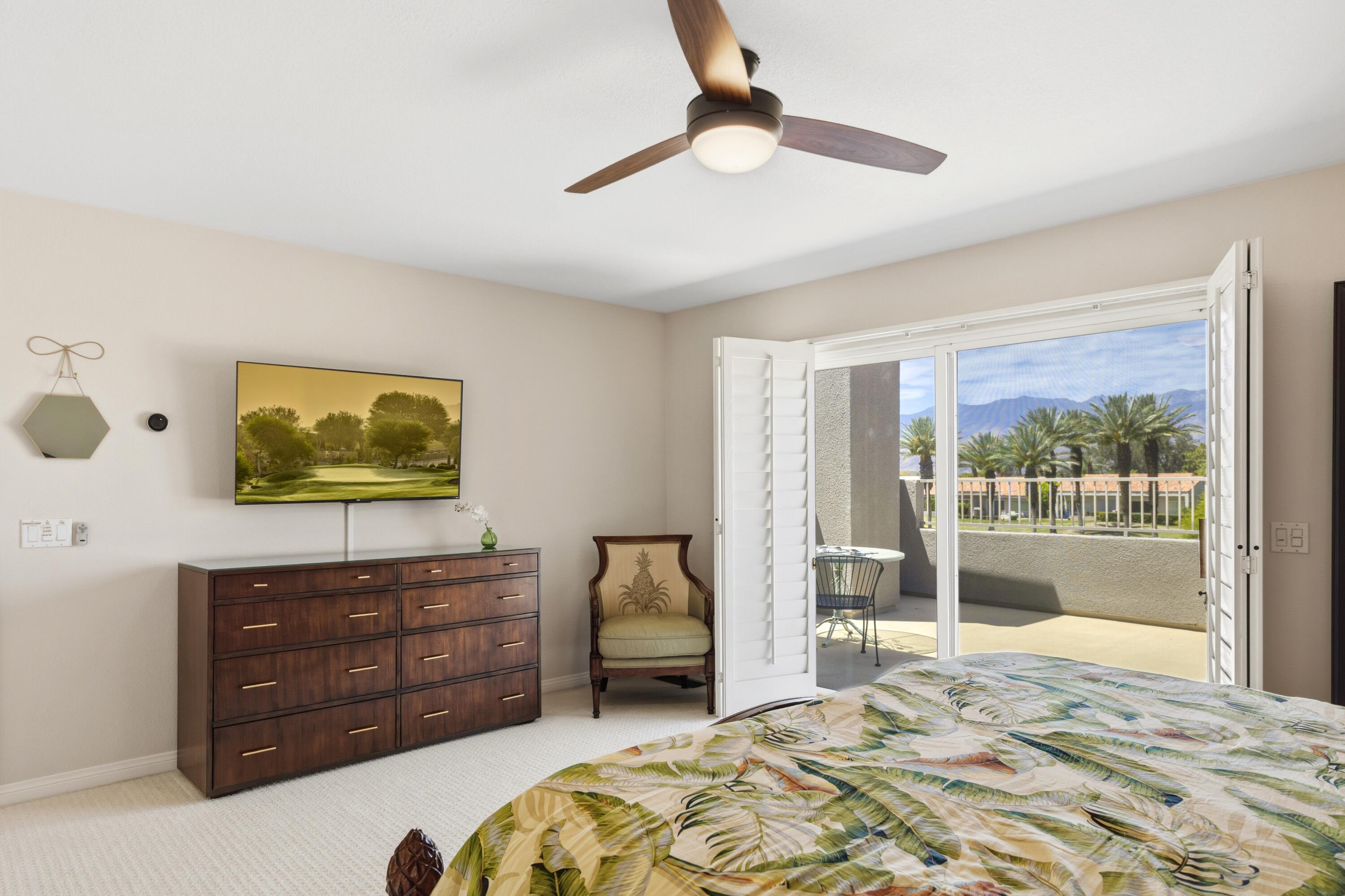 39 Augusta Drive Rancho Mirage, CA 92270 - Photo 35 of 53 a bedroom with a bed and a large window
