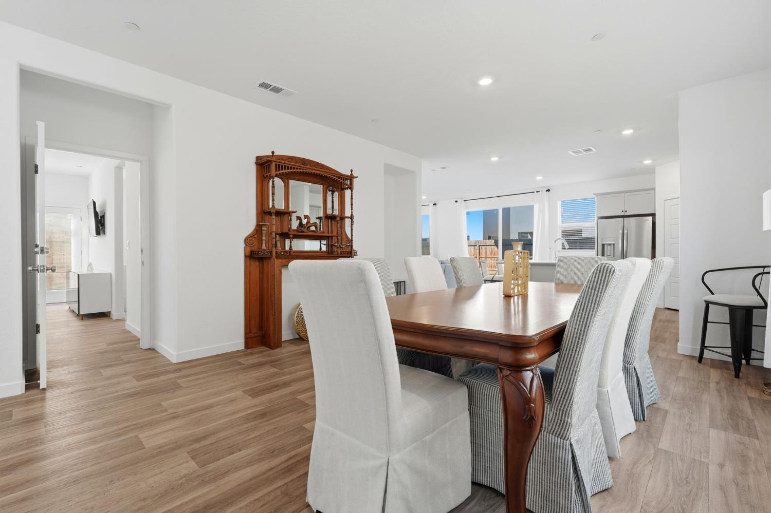 4225 Hampton Way Clovis, CA 93619 - Photo 6 of 37 a view of a dining room with furniture and wooden floor