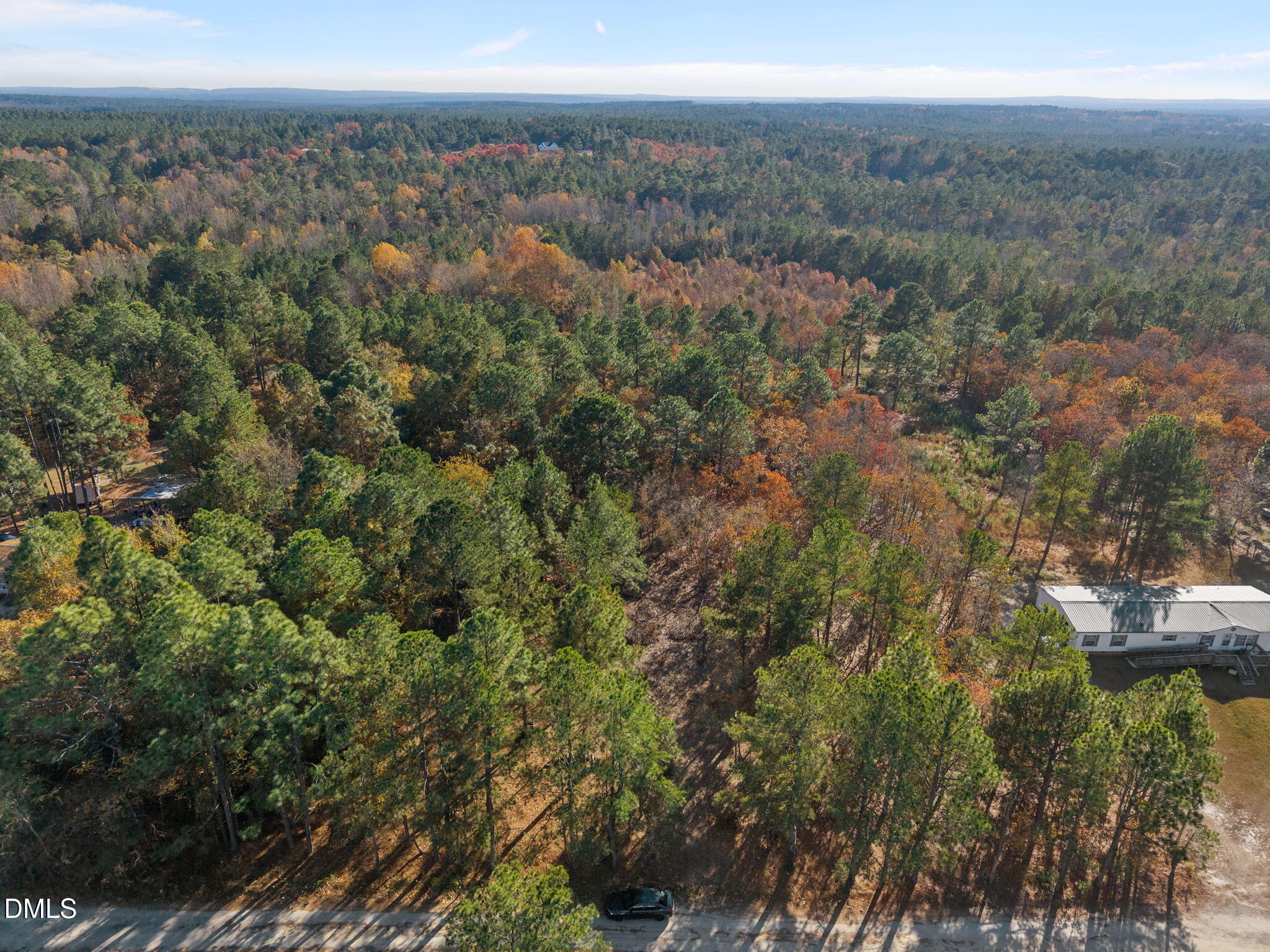 948 Pine Oak Cameron, NC 28326 - Photo 2 of 12 a view of a city with lush green forest
