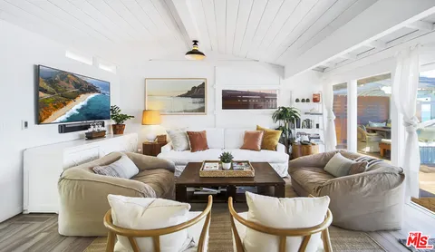 a kitchen with stainless steel appliances a sink dishwasher stove refrigerator and microwave