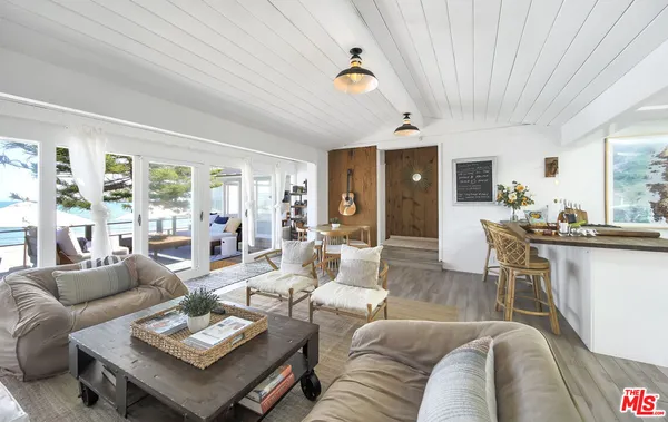 a view of a dining room with furniture and window