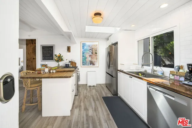 a balcony with furniture and wooden floor
