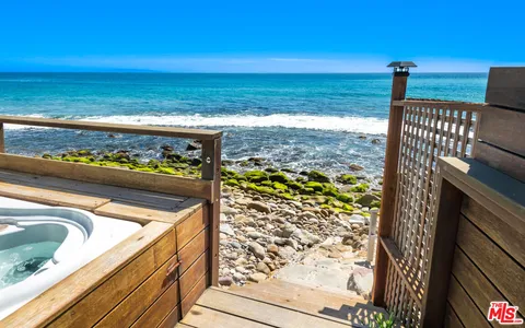a living room with furniture flowerpot and flower pot