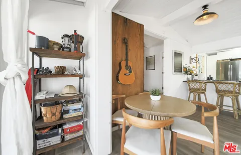 a bathroom with a shower sink and mirror