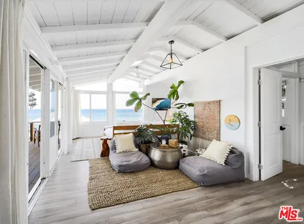 a bathroom with a mirror and vanity