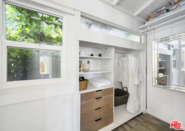 an aerial view of multiple houses with a yard