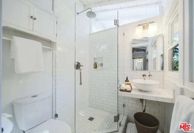 an outdoor space with lots of tall trees