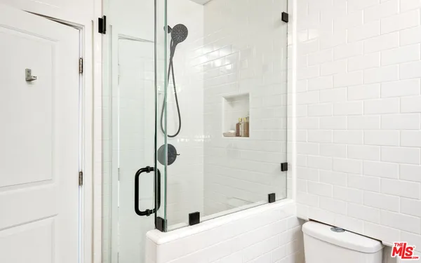 a view of a house with a yard and mountain view in back