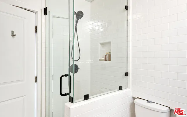 a view of a house with a yard and mountain view in back