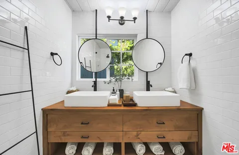 an aerial view of a house with a mountain