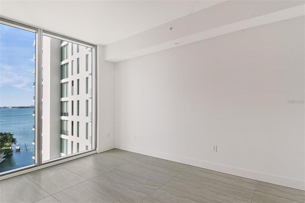 301 Quay Commons, Unit 1011 Sarasota, FL 34236 - Photo 29 of 75 a view of an entryway with wooden floor