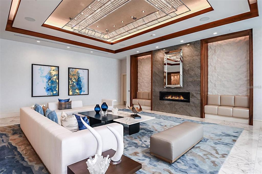 301 Quay Commons, Unit 1011 Sarasota, FL 34236 - Photo 37 of 75 a living room with furniture and a rug