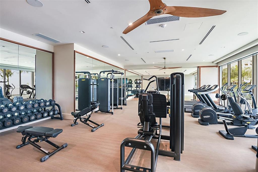 301 Quay Commons, Unit 1011 Sarasota, FL 34236 - Photo 39 of 75 a view of a room with gym equipment