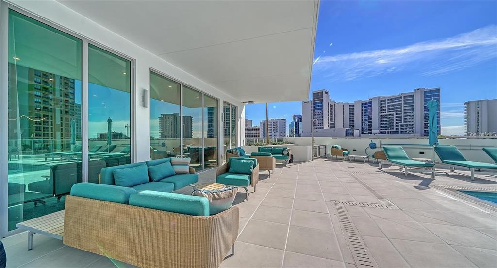 301 Quay Commons, Unit 1011 Sarasota, FL 34236 - Photo 61 of 75 a view of a patio with couches and city view