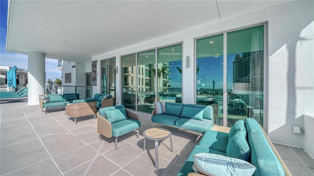 301 Quay Commons, Unit 1011 Sarasota, FL 34236 - Photo 62 of 75 a living room with furniture and a large window
