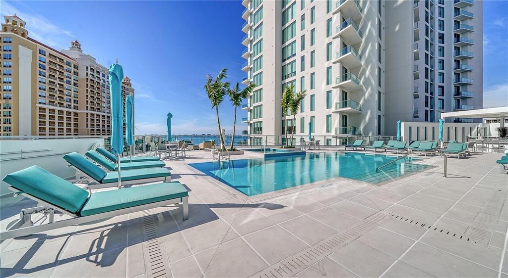 301 Quay Commons, Unit 1011 Sarasota, FL 34236 - Photo 63 of 75 a view of swimming pool with outdoor seating